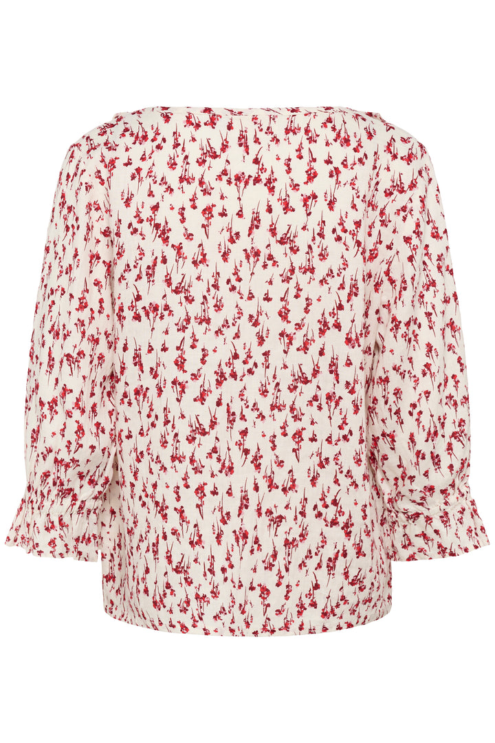 Blouse Bellis à motif délicat avec manches trois-quarts, coupe fluide, encolure en V ornée de volants pour un style féminin et élégant.