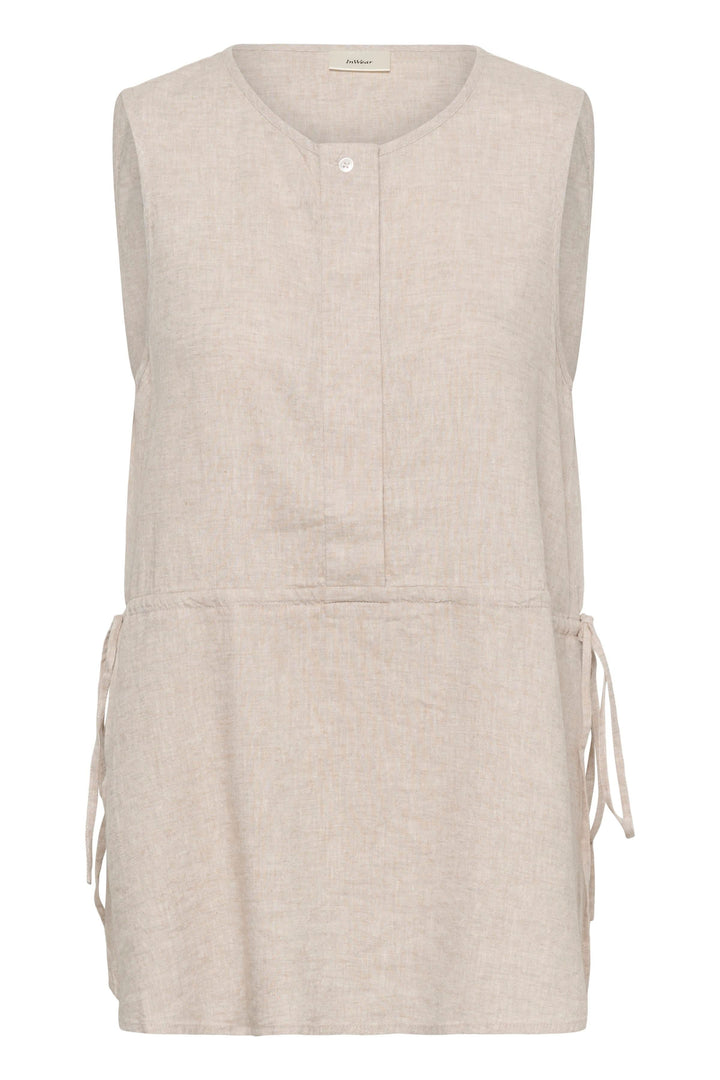 Blouse Rowan sans manches en lin, silhouette épurée en tissu léger, coupe fluide, idéal pour un look minimaliste et moderne.