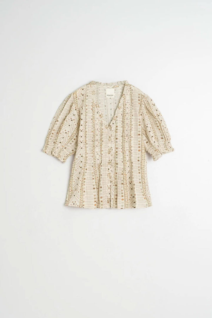 Blouse fluide imprimée à manches courtes avec encolure en V et manches bouffantes, parfaite pour un style décontracté ou habillé.