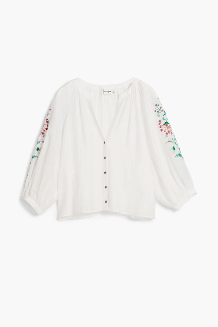 Blouse fluide à manches brodées blanches avec encolure en V et détails floraux colorés