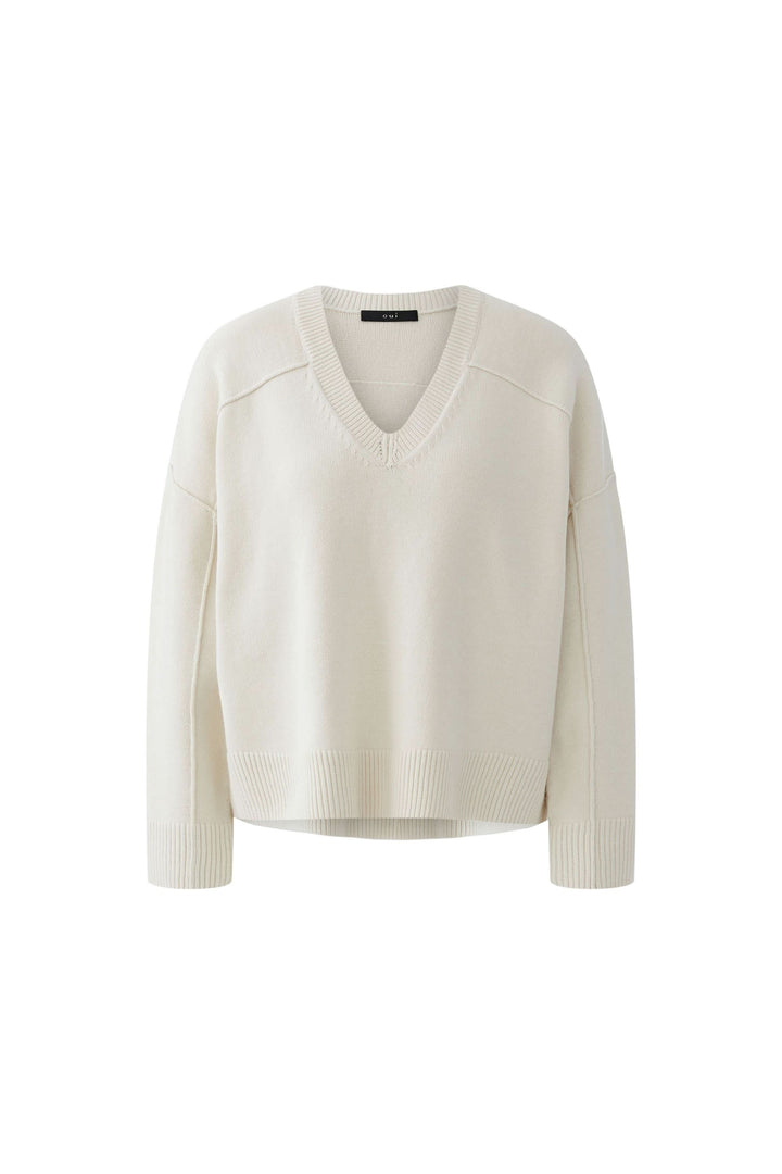 Chandail en maille à col en V blanc, manches longues, style épuré et intemporel, pour un look raffiné et confortable quotidien.