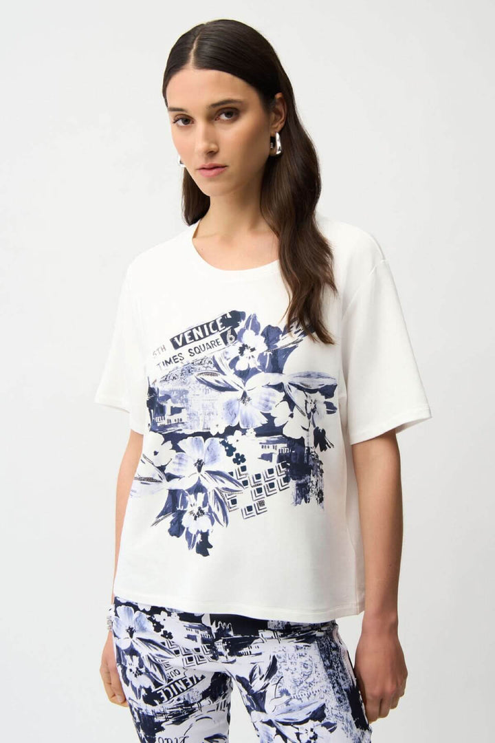 Femme portant un chandail imprimé avec design artistique inspiré du voyage, coupe décontractée, parfait pour un look moderne et flatteur.