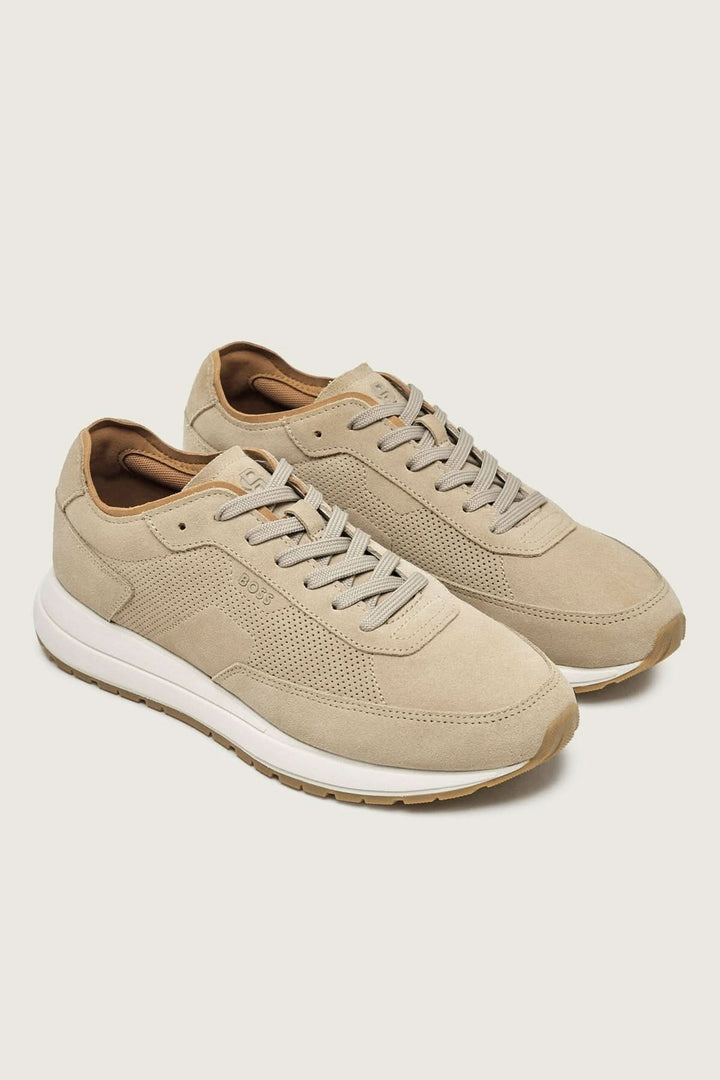 Chaussure de ville Vinston en suède perforé beige avec semelle blanche, design élégant et minimaliste pour style moderne et confort.