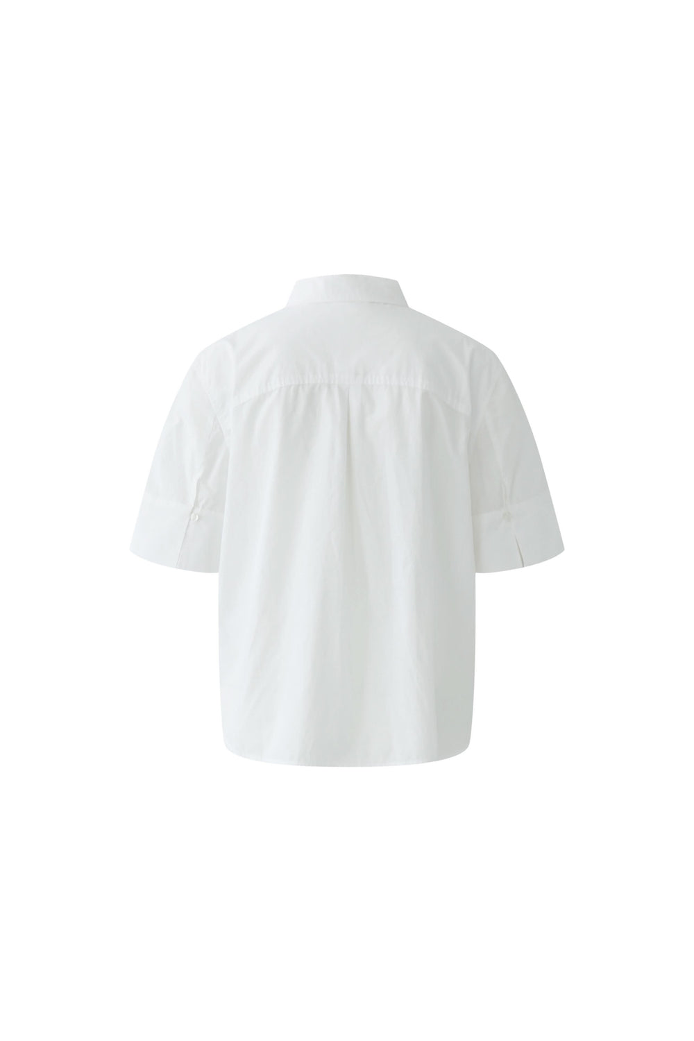 Dos de chemise à manches courtes avec broderie, coupe fluide, col classique, féminine et moderne.