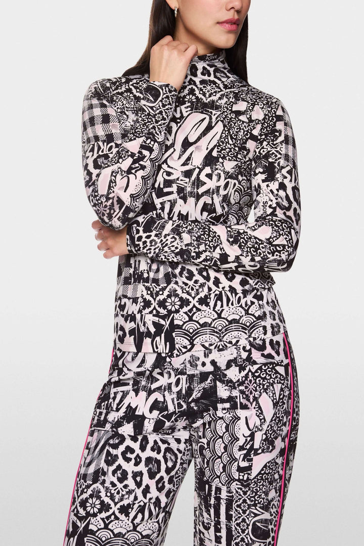 Col roulé imprimé tendance avec motifs graphiques audacieux, coupe ajustée et tissu extensible.