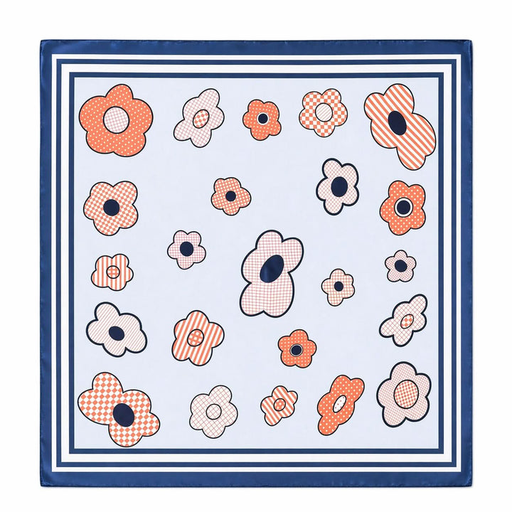 Foulard carré imprimé fleurs graphiques avec motif floral stylisé, texture légère et bordure contrastante pour un style moderne.