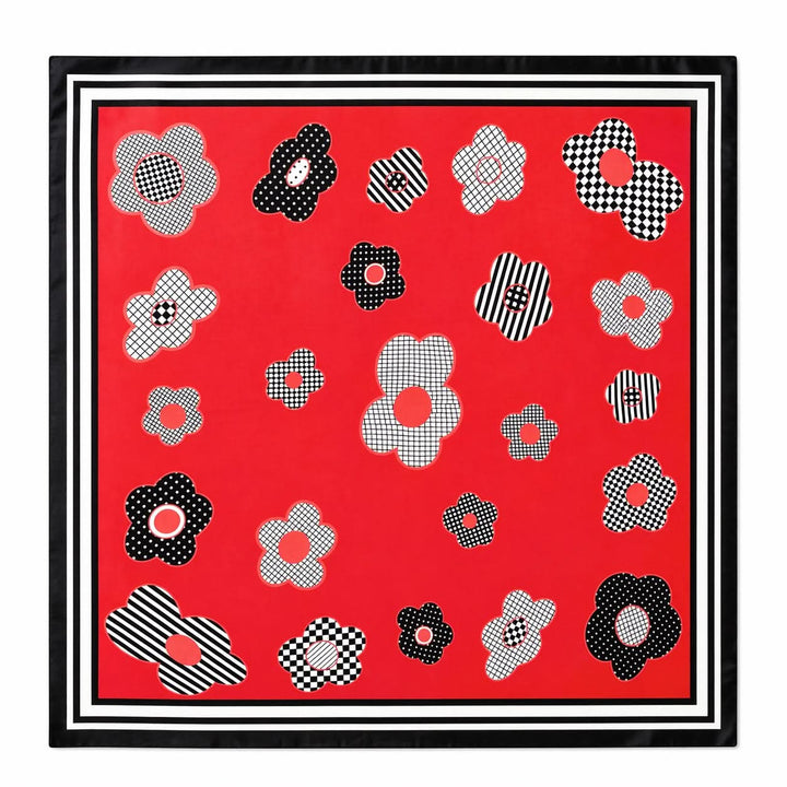 Foulard carré imprimé fleurs graphiques rouge avec motifs floraux stylisés noirs et blancs, bordure contrastante pour un look moderne.