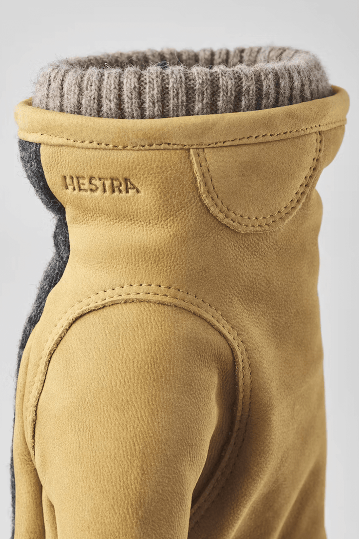 Gants en cuir Hestra avec revers en laine, idéal pour l'hiver et les activités en plein air.
