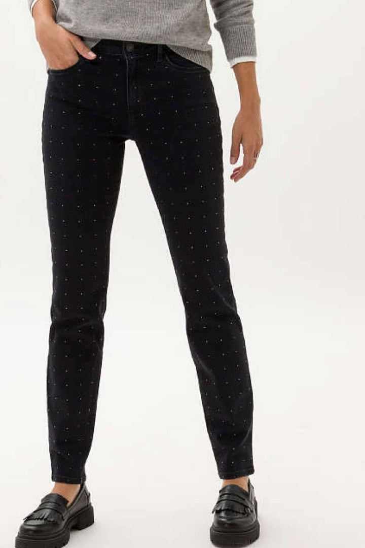 Jean Shakira skinny femme noir avec strass, poches sophistiquées et style tendance.