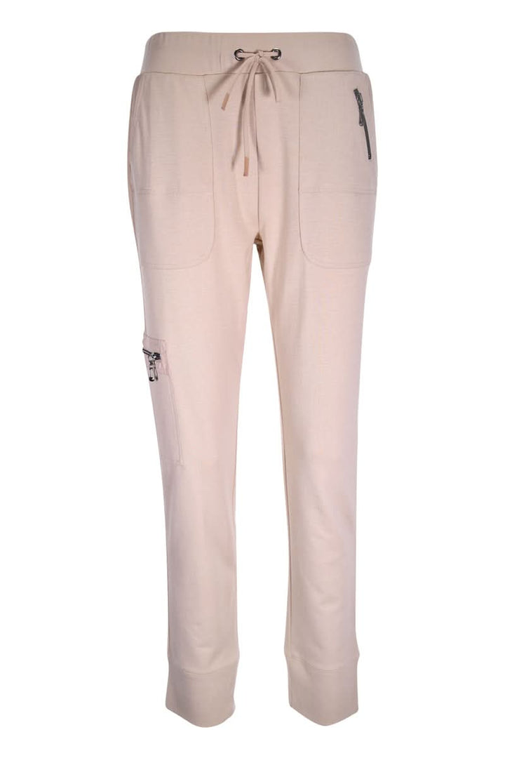 Jogging ajusté beige avec taille élastique et poches latérales, offrant un style moderne et dynamique. Parfait pour un look sportif chic.