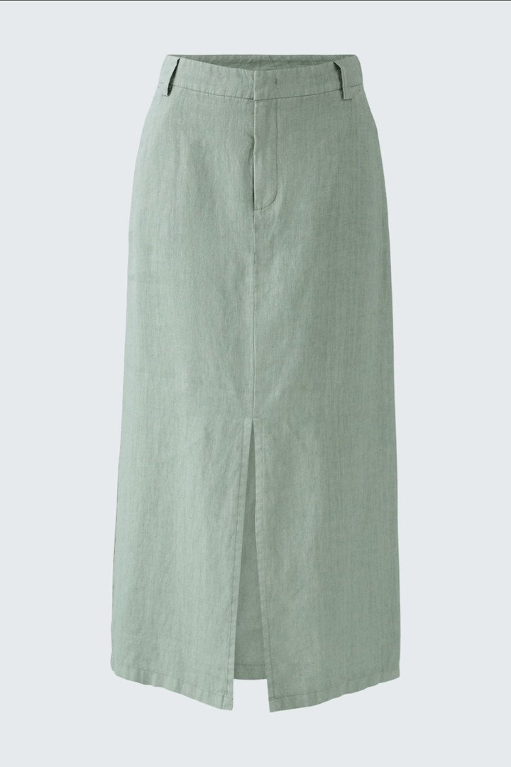 Jupe longue en lin vert avec fente avant, taille haute et poches, parfaite pour un look estival décontracté.