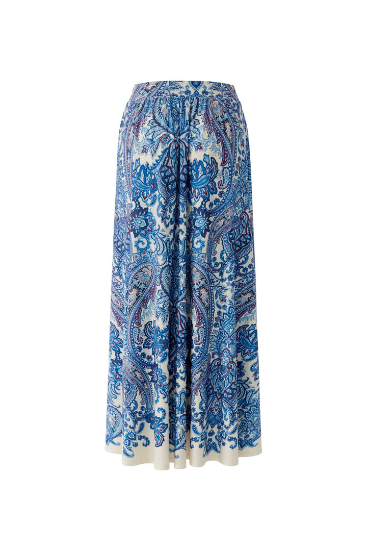 Jupe longue imprimée à taille élastique avec motif cachemire bleu, offrant élégance bohème et confort.