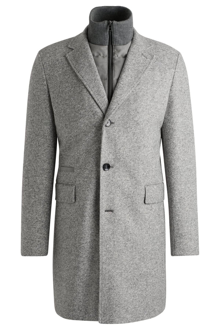 Manteau à chevrons gris en laine mélangée avec fermeture amovible et coupe ajustée.