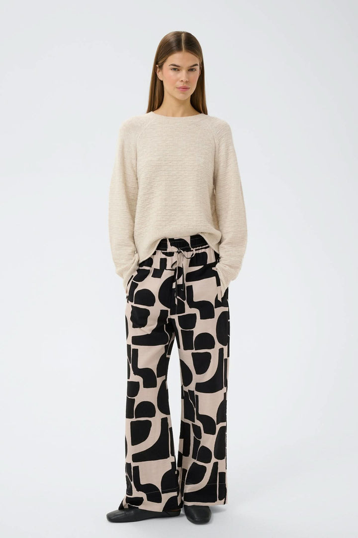 Pantalon fluide motif abstrait Lynn avec coupe ample et taille élastique, offrant une allure moderne et décontractée.