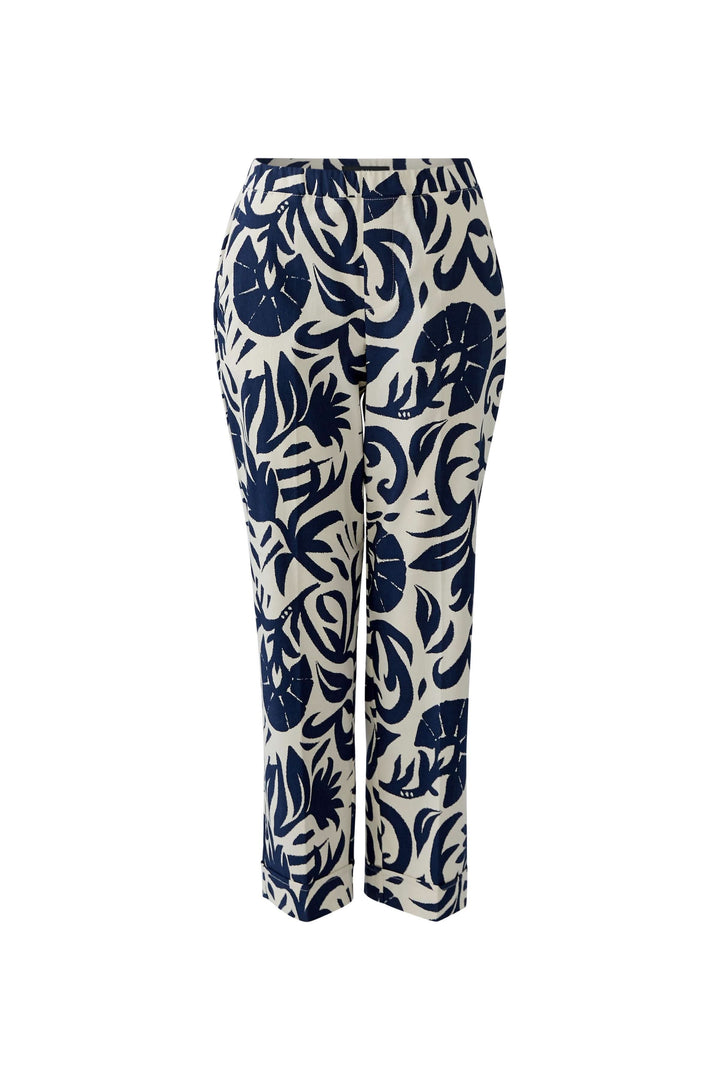 Pantalon imprimé moderne avec motif abstrait, offrant une silhouette actuelle et confortable, idéal pour un look habillé ou décontracté.
