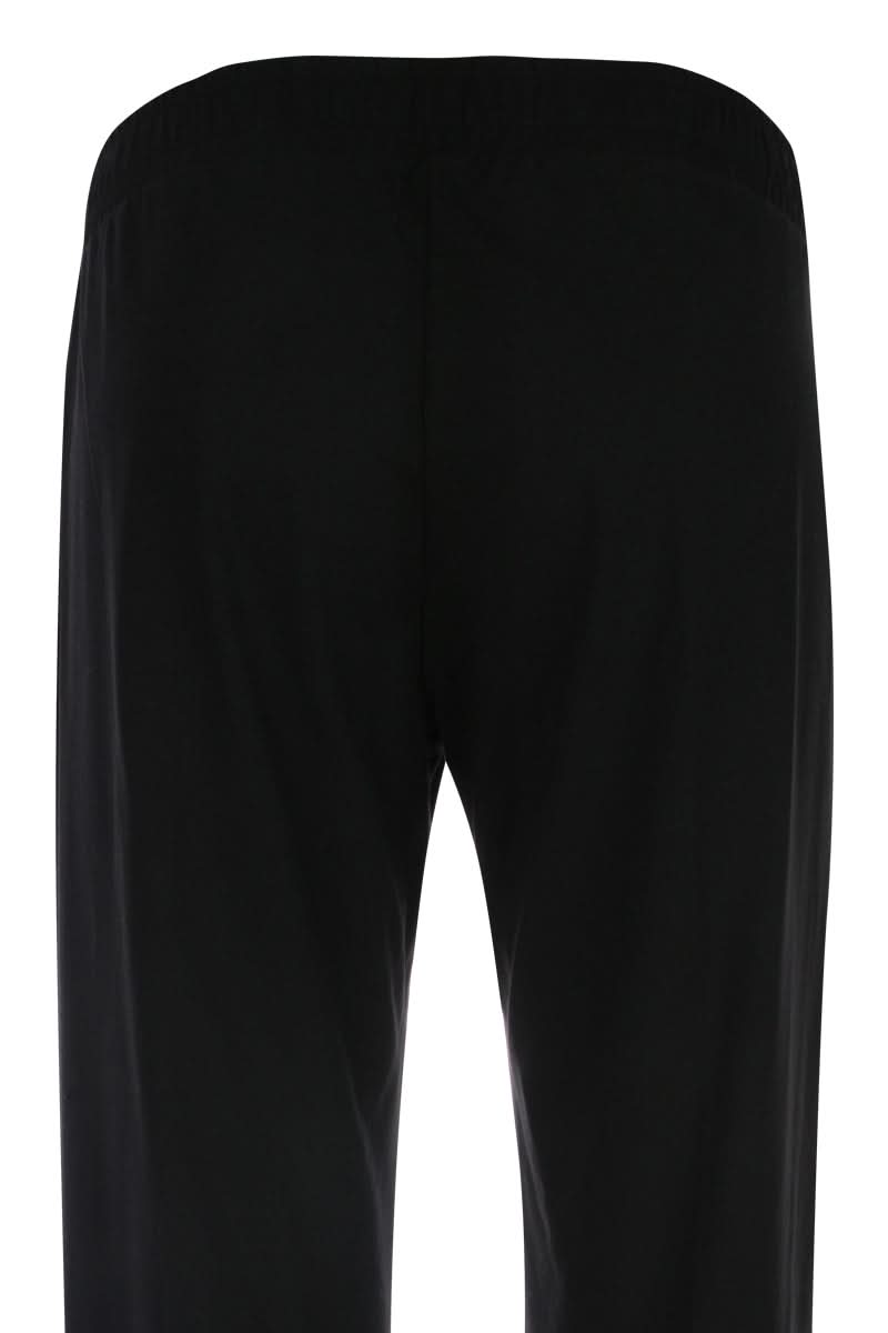 Vue arrière du pantalon jambe large noir, coupe fluide et confortable, idéal pour une silhouette élégante. Pantalon jambe large.