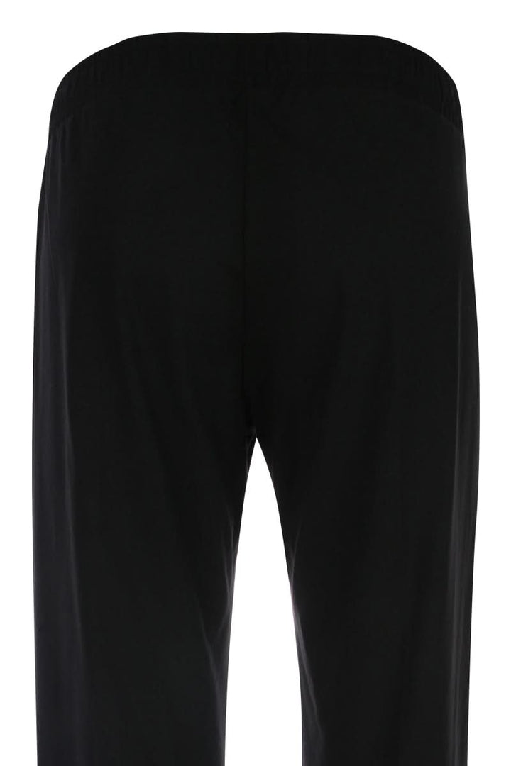 Vue arrière du pantalon jambe large noir, coupe fluide et confortable, idéal pour une silhouette élégante. Pantalon jambe large.