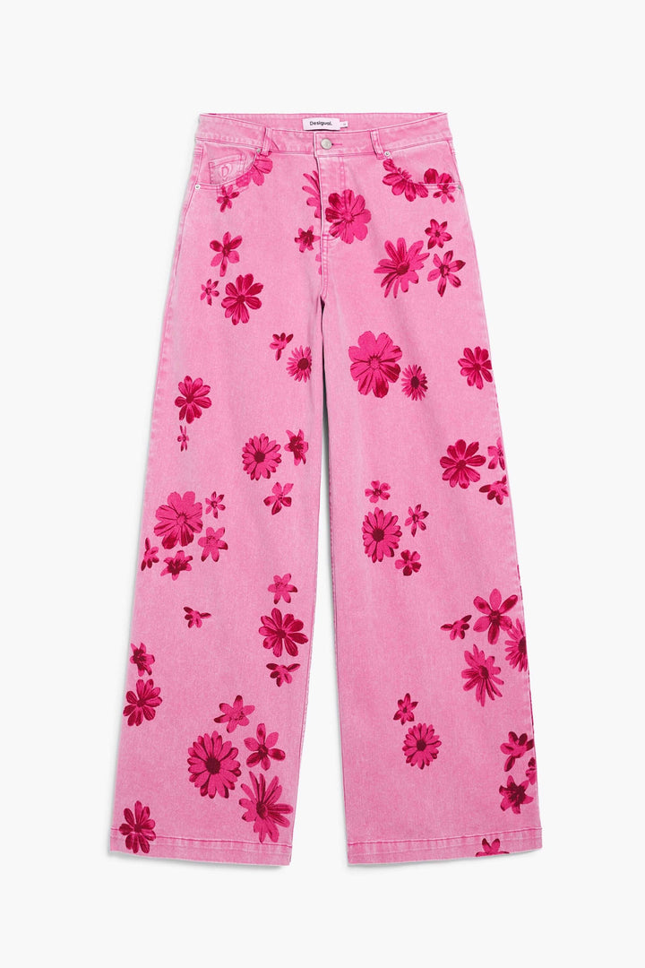 Pantalon large à imprimé floral avec motif audacieux, coupe fluide et confortable, parfait pour un look affirmé et féminin.