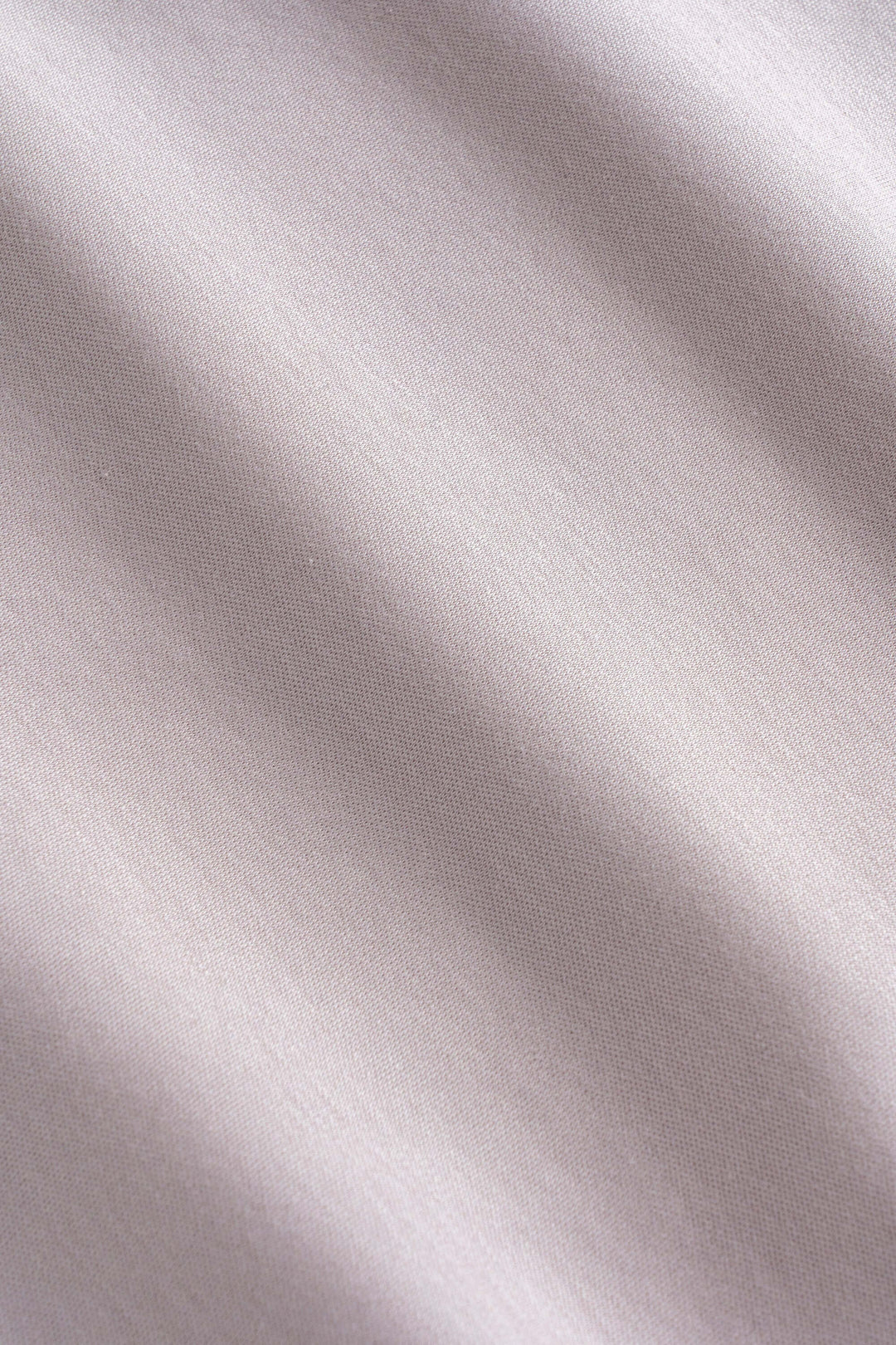 Tissu technique lisse et extensible pour un t-shirt à manches courtes, couleur beige claire.