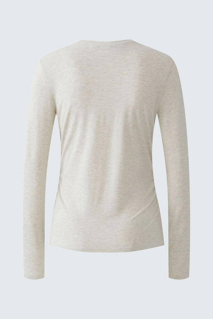 T-shirt manches longues beige vue arrière avec fronces latérales flatteuses.