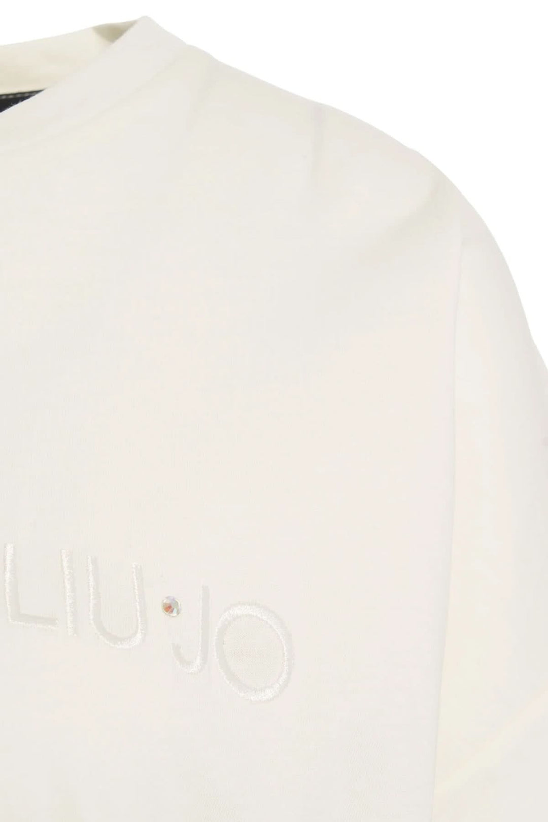 T-shirt oversize avec logo brodé en coton doux, détail du logo sur la poitrine, coupe décontractée et ourlet élastiqué élégant.
