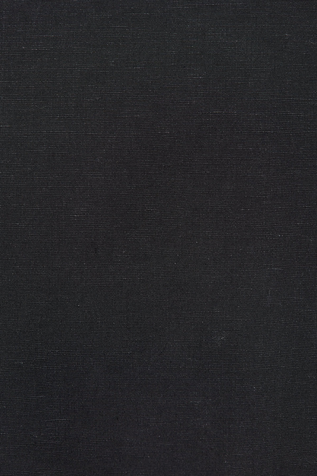 Texture noire de la Veste tailleur Loric sans manches en gros plan.
