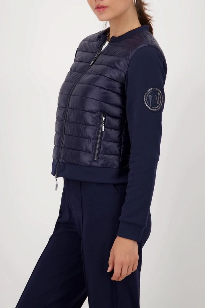 Veste matelassée bimatière à fermeture éclair avec manches souples en bleu marine, femme