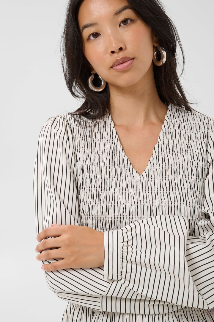 Front view of the women’s striped Dewa blouse Part Two