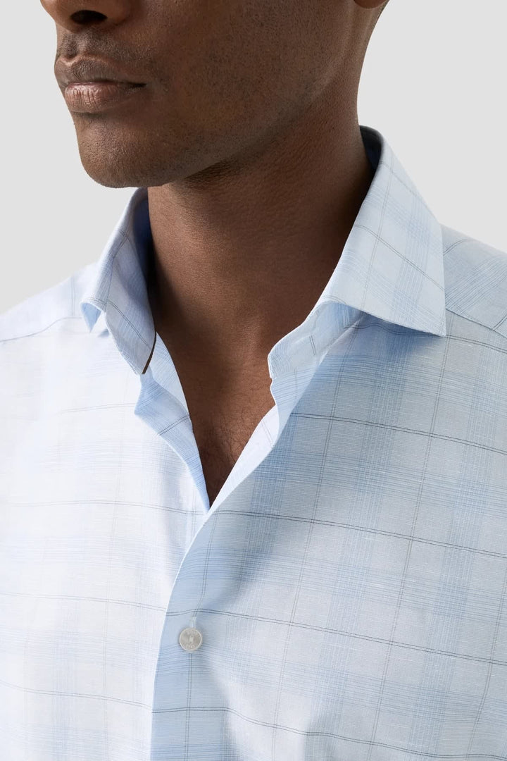 Front view of a subtle blue Eton checkered men&
