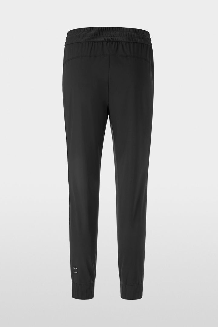 Pantalon habillé Rhodos effet cuir, coupe fuselée, taille élastique, style moderne et confortable.