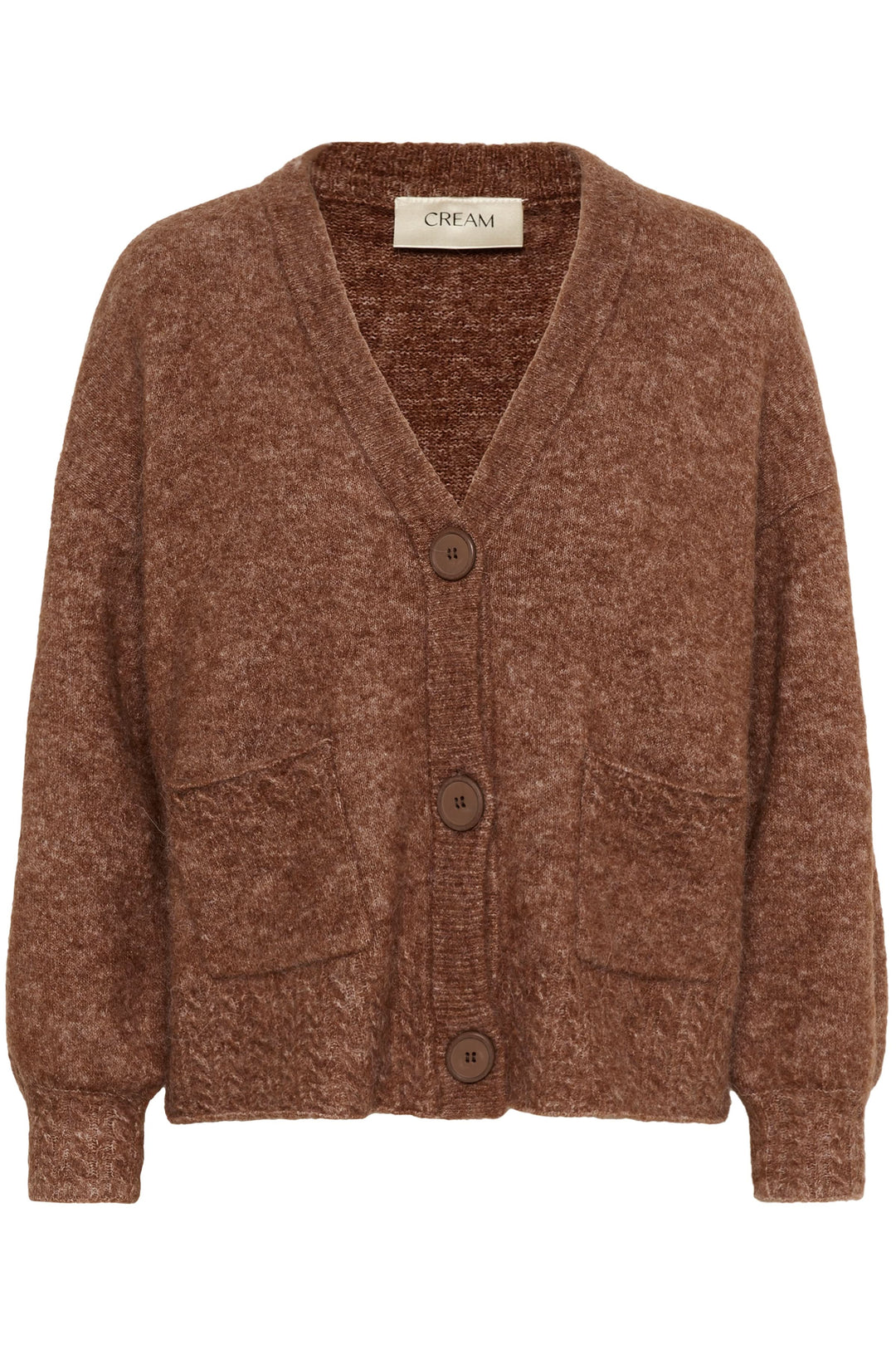 Cardigan Blues en tricot doux à boutons apparents avec texture moelleuse et poches plaquées, idéal pour un look décontracté et chaleureux.