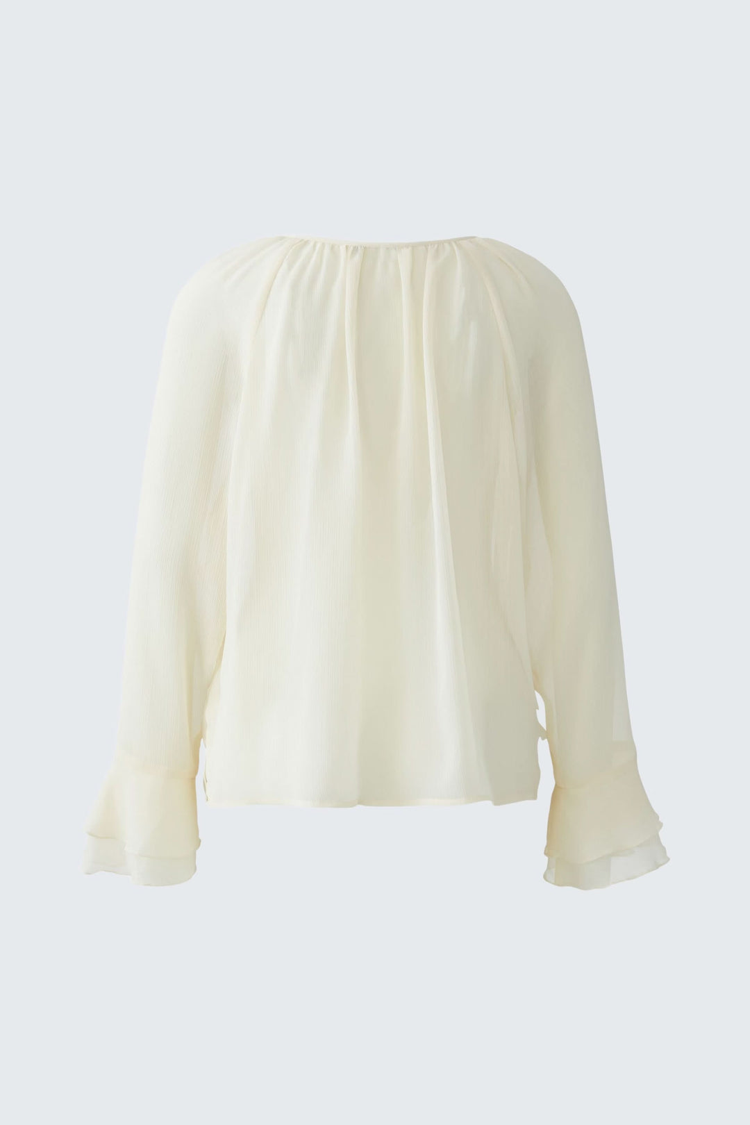 Blouse fluide à volants et lien au col en tissu léger, élégante et romantique, vue de dos, parfaite pour un look chic.