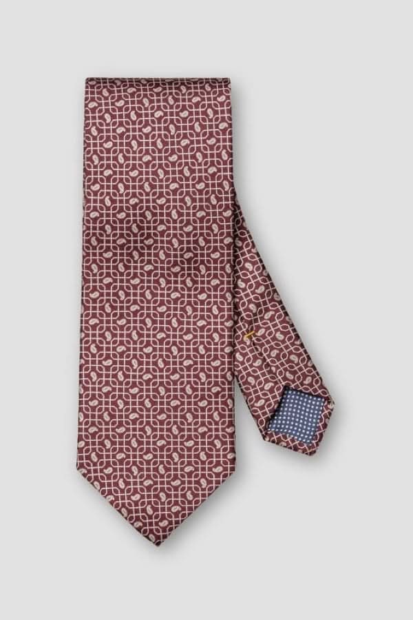 Cravate à motif géométrique en soie italienne avec finition lustrée, idéale pour événements élégants et tenues professionnelles.