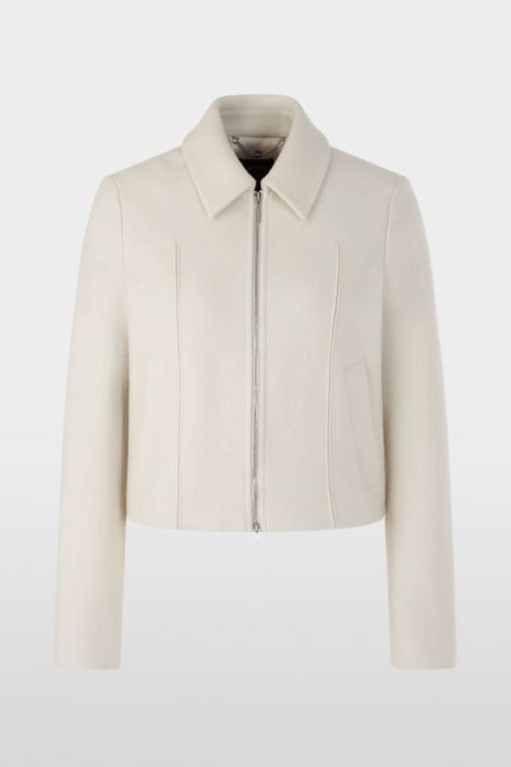 Veste en laine vierge avec fermeture éclair, poches passepoilées, et poignets fendus, fabriquée en Allemagne.