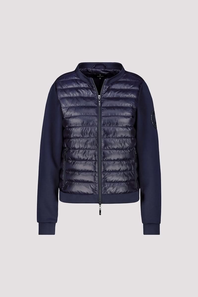 Veste matelassée bimatière à fermeture éclair, décris moi le produit en français, style moderne et confortable.