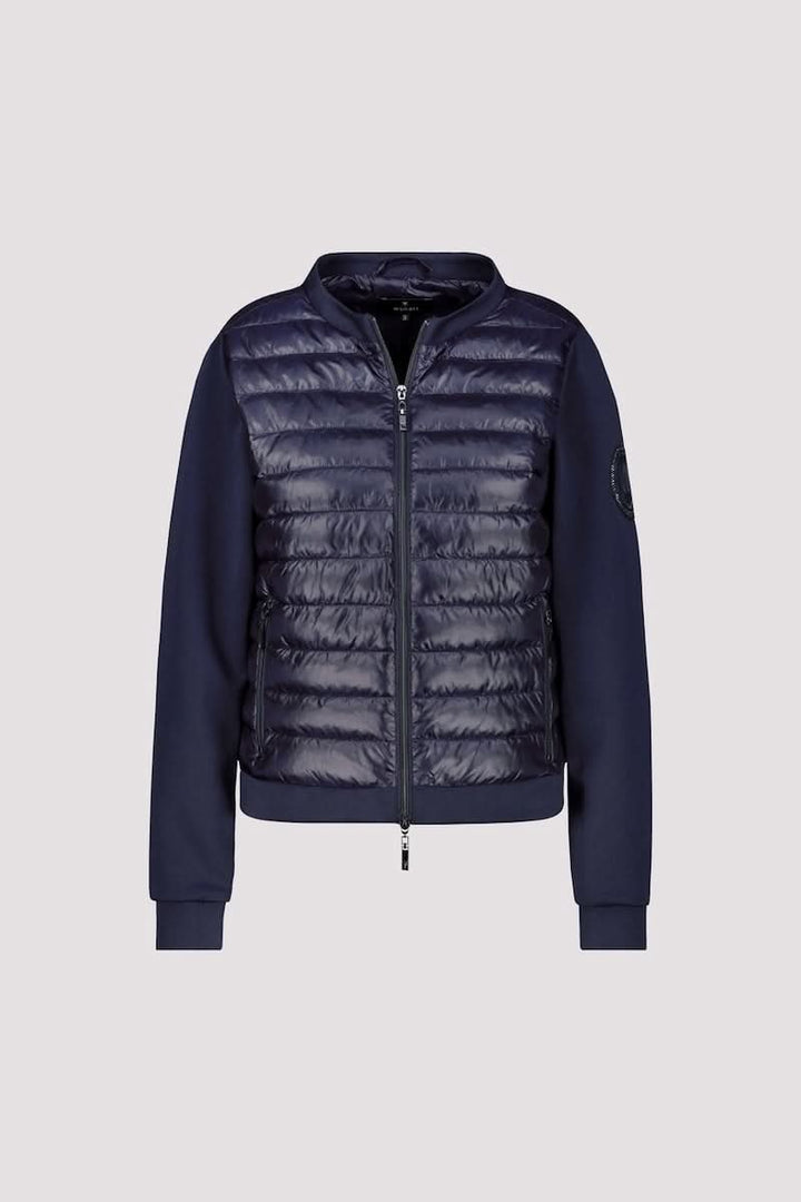 Veste matelassée bimatière à fermeture éclair, décris moi le produit en français, style moderne et confortable.