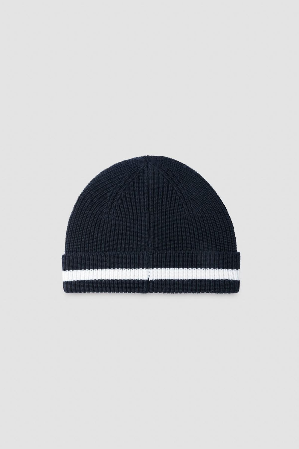 Tuque douce en tricot côtelé noir avec bande contrastante blanche, idéale pour l'hiver.