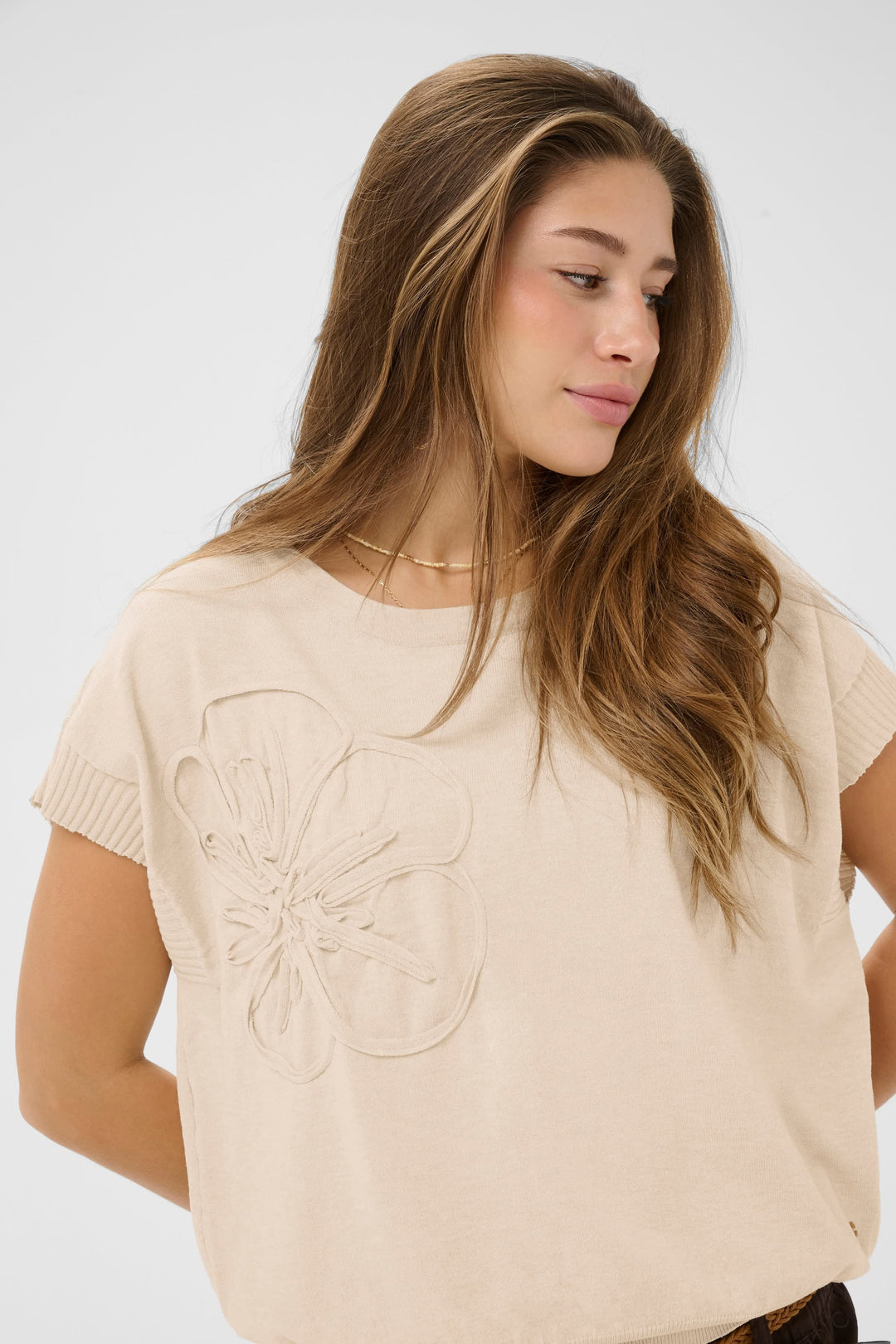 Close-up of a beige women&