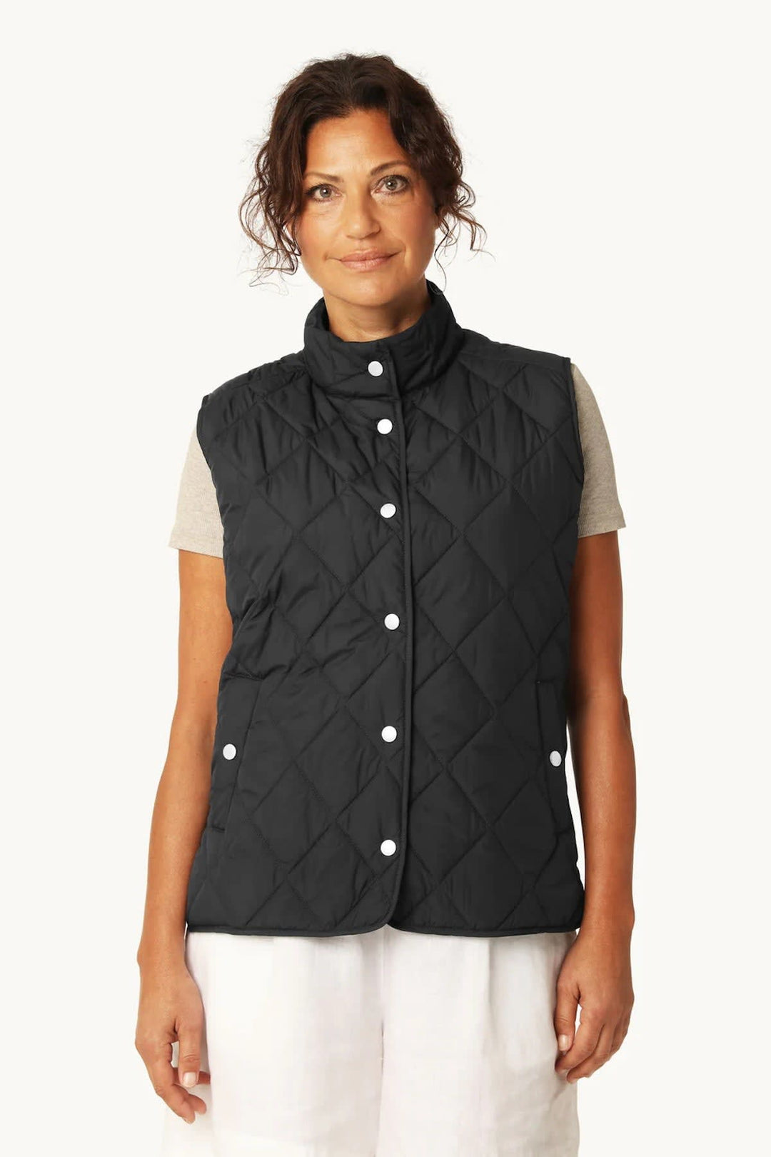Side view of the Ilse Jacobsen women's black quilted jacket with pockets and a high collar - Valérie Simon