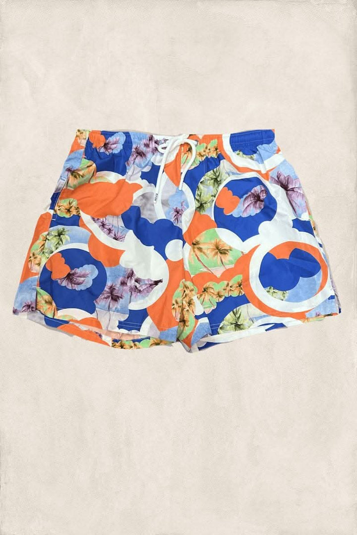 Maillot de bain coloré avec motifs floraux et graphiques en bleu, orange et vert.